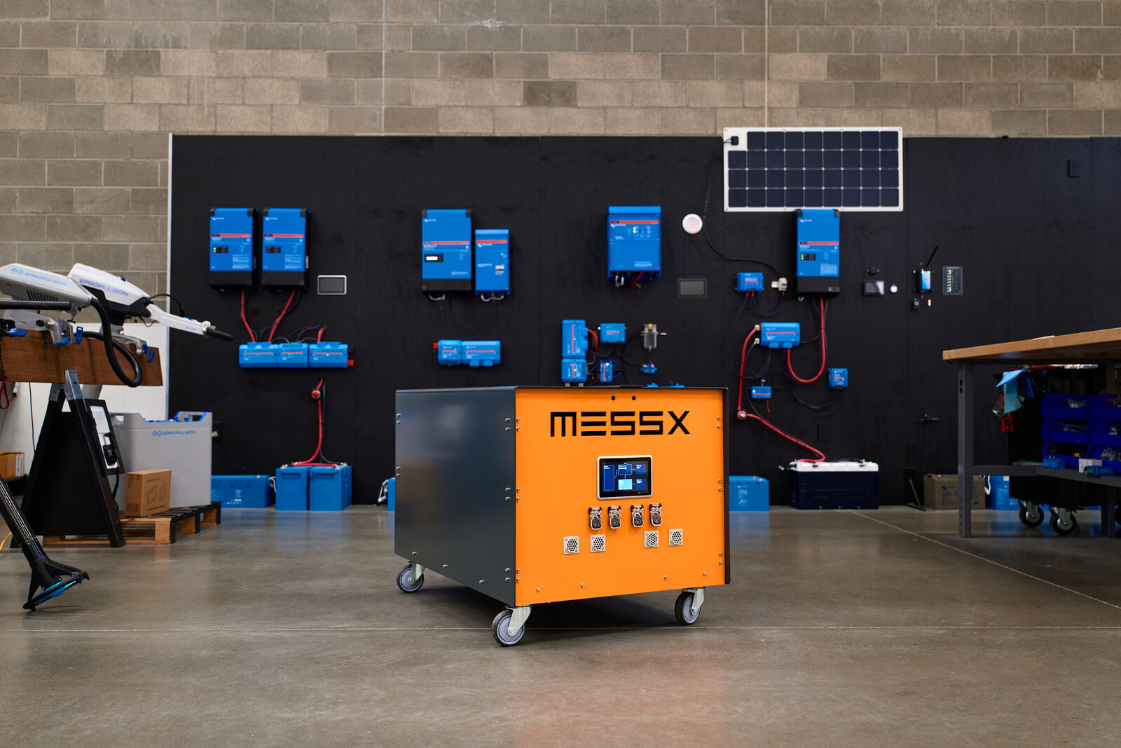 A MESSX mobile power system in the shop, in front of the full Victron Energy integration wall