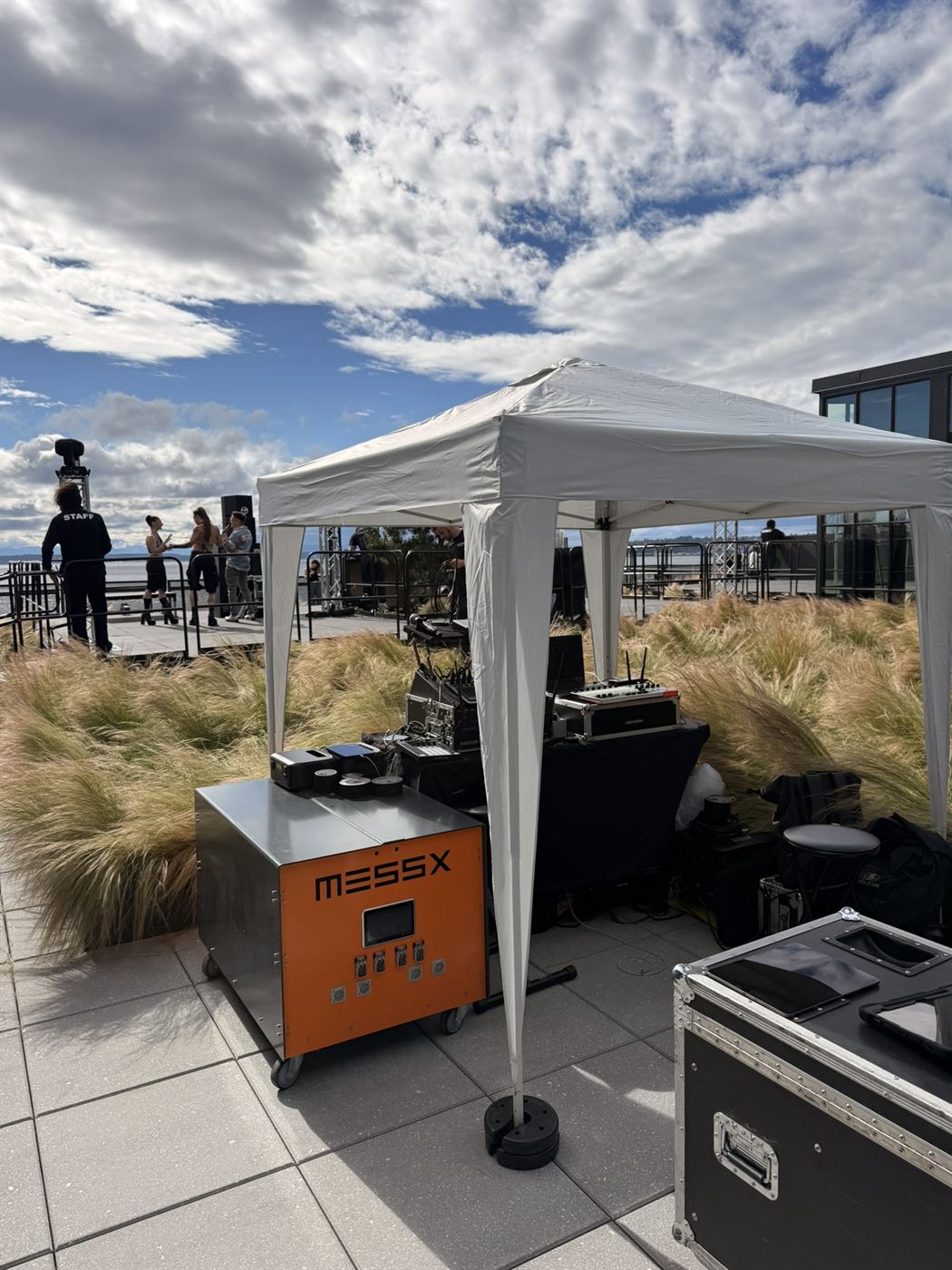 MESSX 10K powering the DJ booth and production tent on the rooftop, Seattle waterfront behind